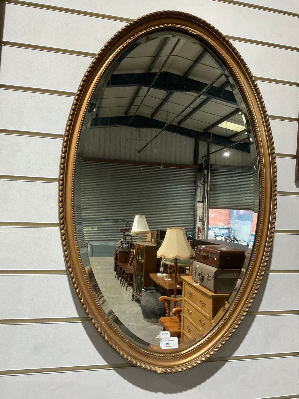 Lot 198: Gilt Framed Oval Wall Mirror with Bevelled Plate