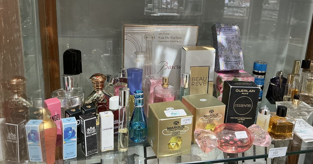 Lot 222: A Collection of Modern and Vintage Fragrances and Cosmetics Including Guerlain and Marque Collection some bottles are empty