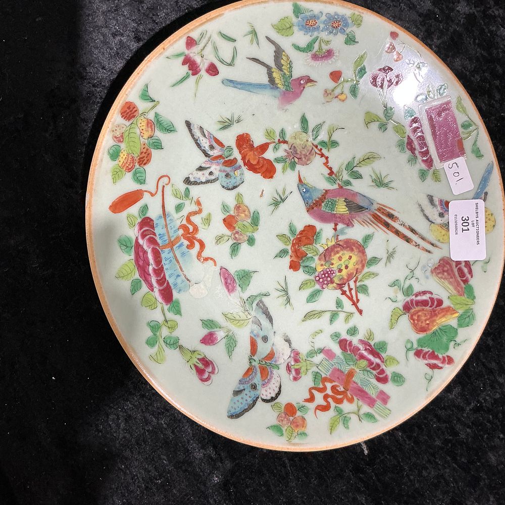 Lot 301: A famille rose celadon-ground 'birds and butterflies' dish, Qing Dynasty (19th century)