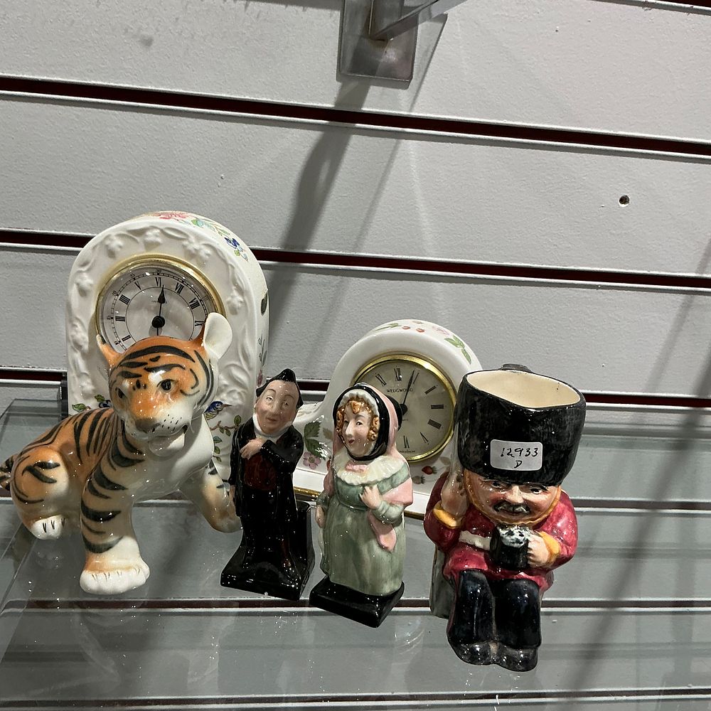 Lot 320: A Collection of Glazed Ceramic Mantel Clocks and Character Figurines