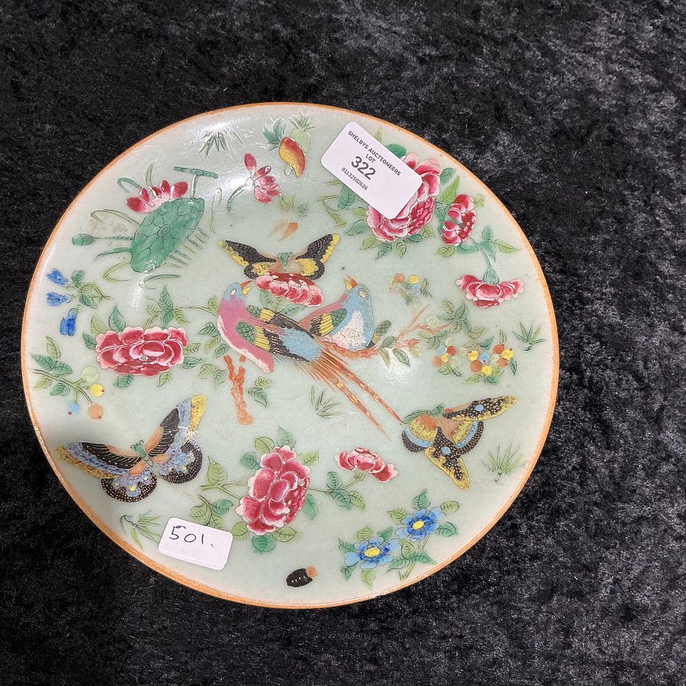 Lot 322: A famille rose celadon-ground 'birds and butterflies' dish, Qing Dynasty, 19th century