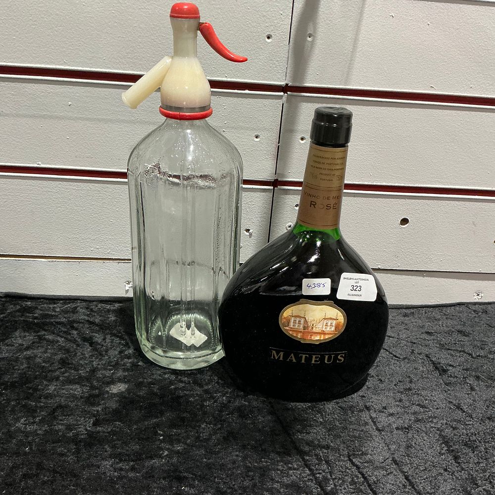 Lot 323: Two Beverage Bottles Comprising Mateus Rosé Wine and a Fluted Glass Soda Siphon
