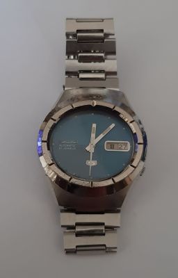 שעון סייקו 5 SEIKO מנגנון אוטומטי, 21 אבנים, תאריכון ויום בשבוע, לוח כחול. השעון עובד. קוטר 37 