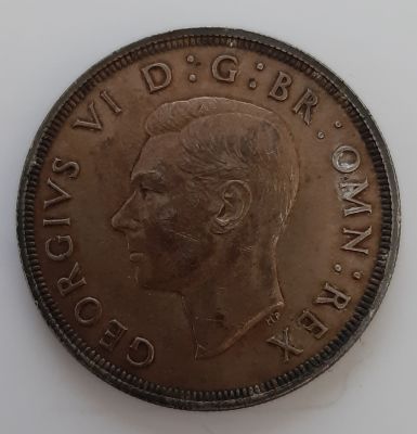 מטבע בריטי כסף כתר אחד משנת 1937 במצב VF במשקל 28.32 גרם.