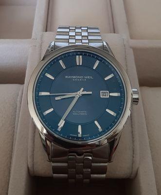 שעון שוויצרי יוקרתי לגבר ריימונד וויל RAYMOND WEIL WATCH. רצועת מתכת סגירת פטנט. מצב כמו חדש 