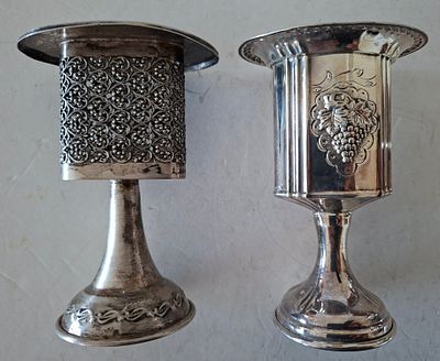 לוט 2 מחזיקי נר הבדלה כסף. אחד תוצרת הצורפים כסף 925 השני חתימה לא ברורה של היצרן וטוהר הכסף. 
