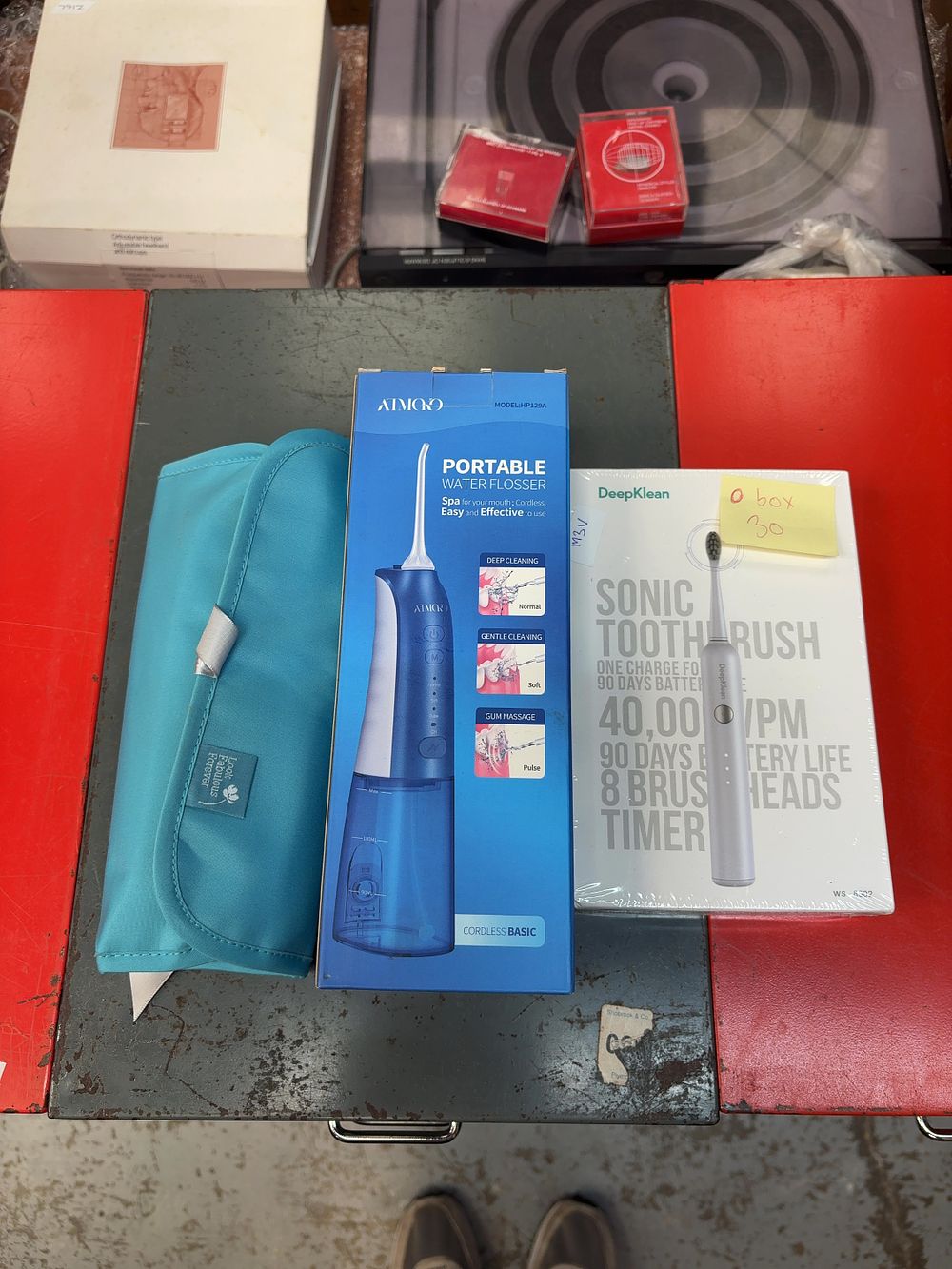 Lot 301: Three Items of Personal Dental Care Including AIMOO...