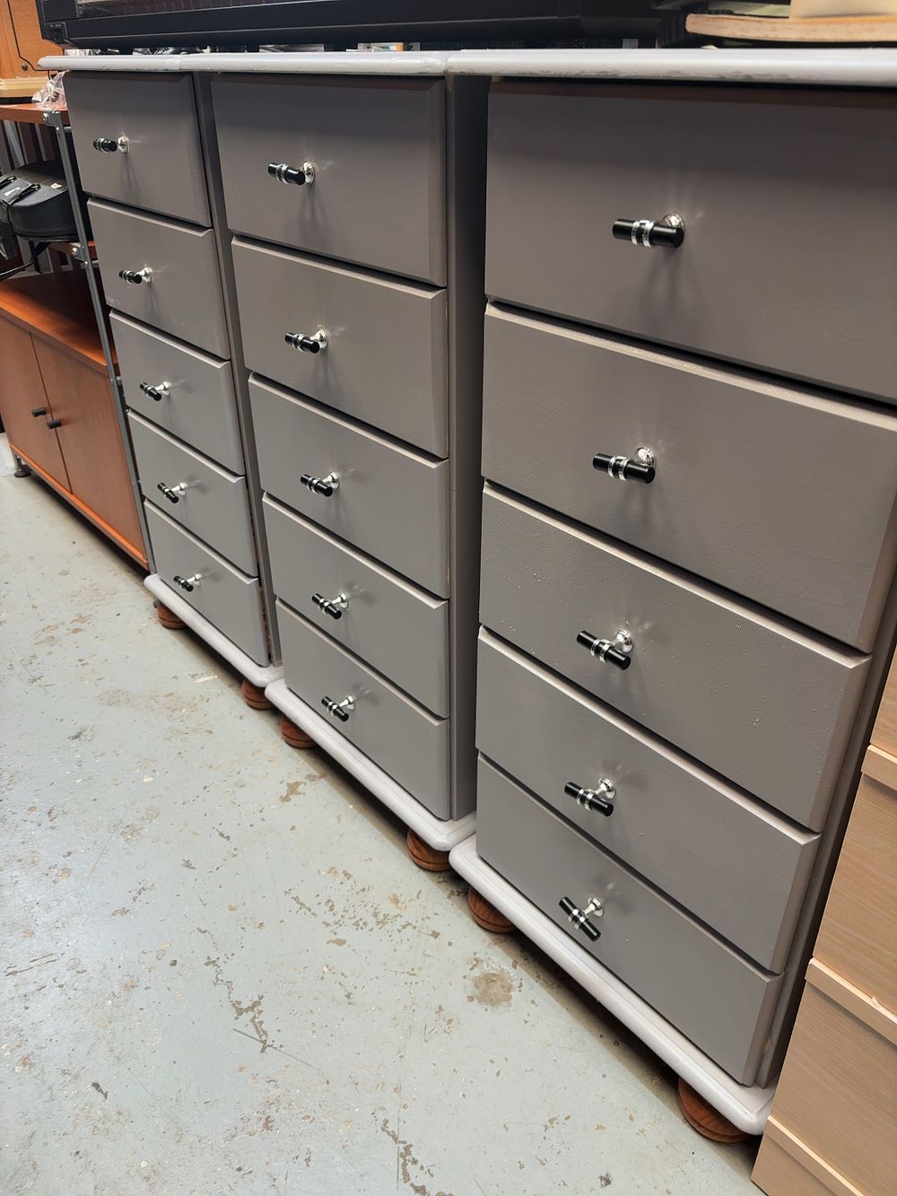 Lot 306: A Trio of Contemporary Grey Painted Five Drawer...