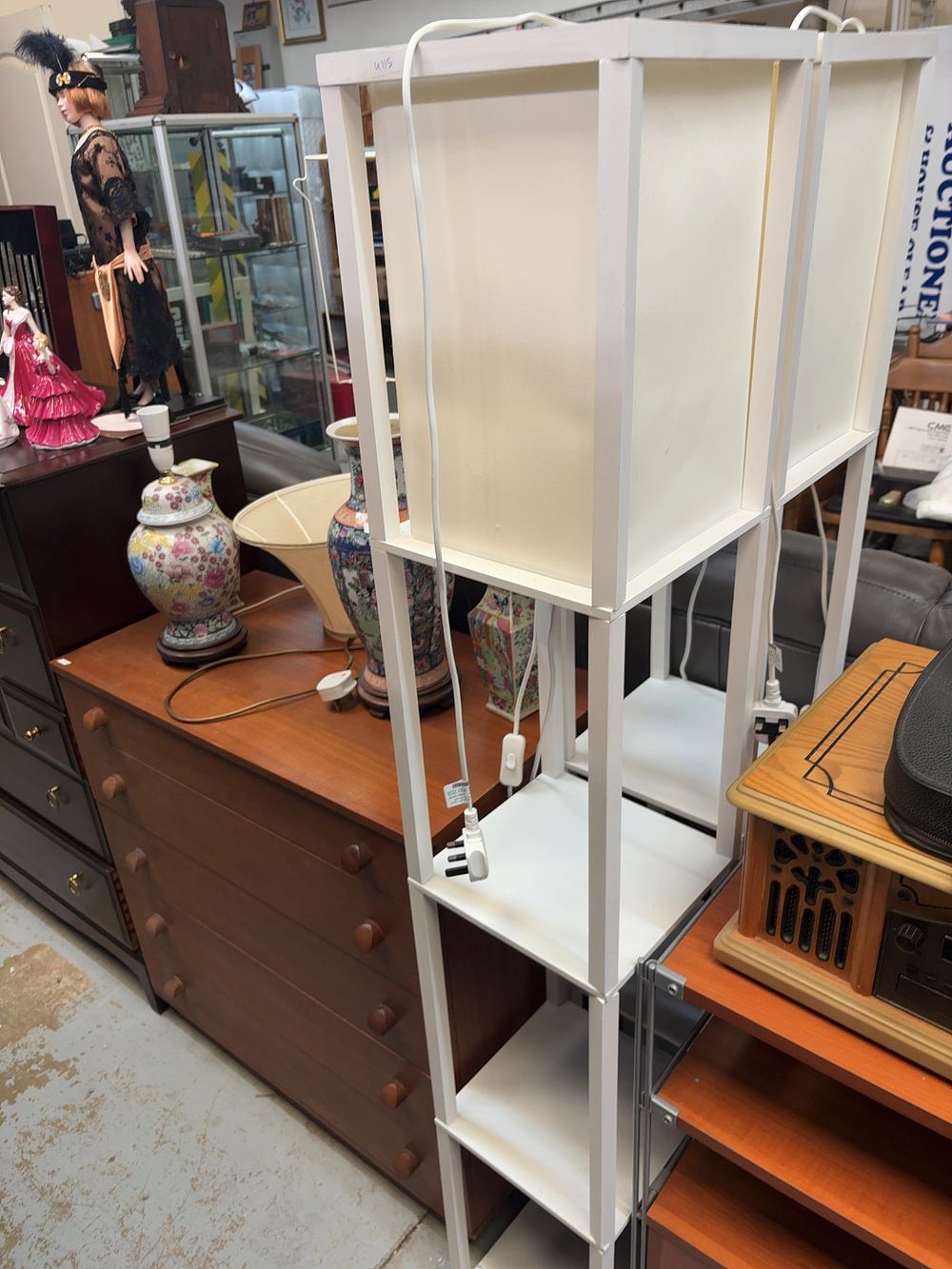 Lot 310: A Pair of Contemporary White Tiered Etagere Floor...