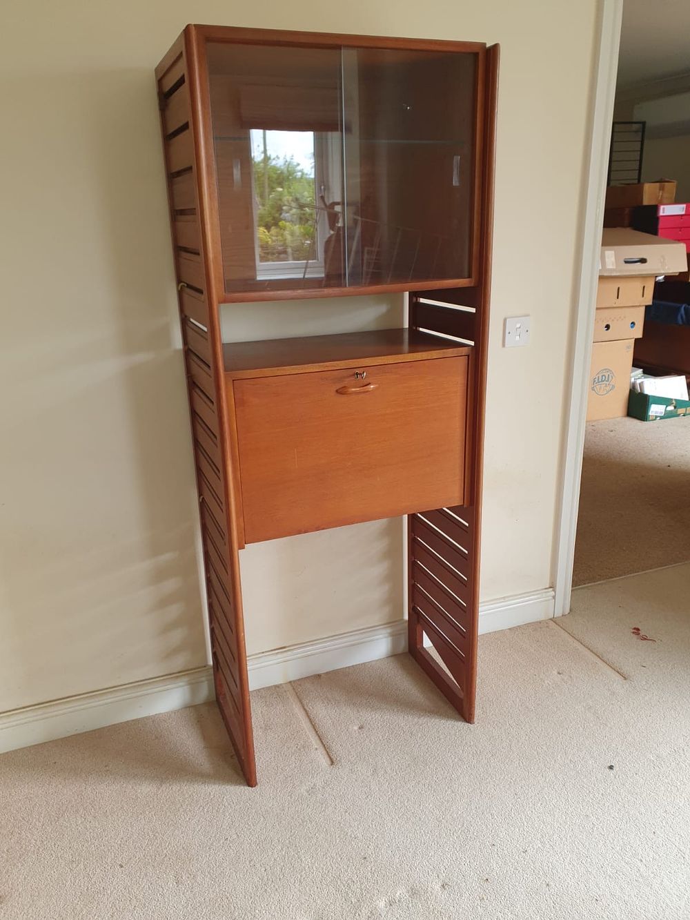 Lot 447: A Collection of Mid-Century Teak Modular Shelving and...