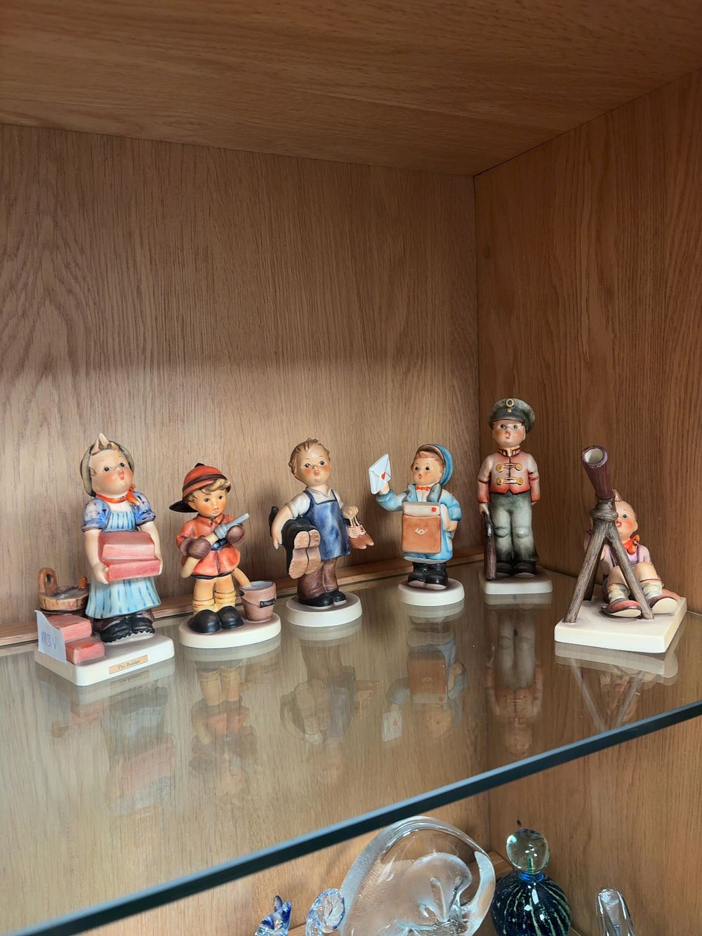 Lot 484: A Collection of Goebel Hummel Hand-Painted Ceramic Figurines