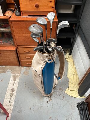 An Assortment of Vintage Golf Clubs by Howson and Northwestern with Two-Tone Bag