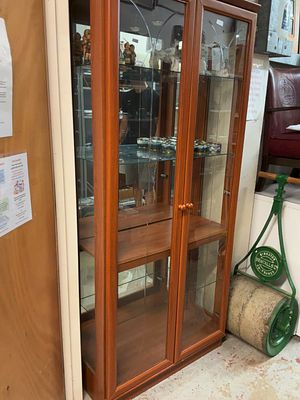 A contemporary two-door glazed display cabinet