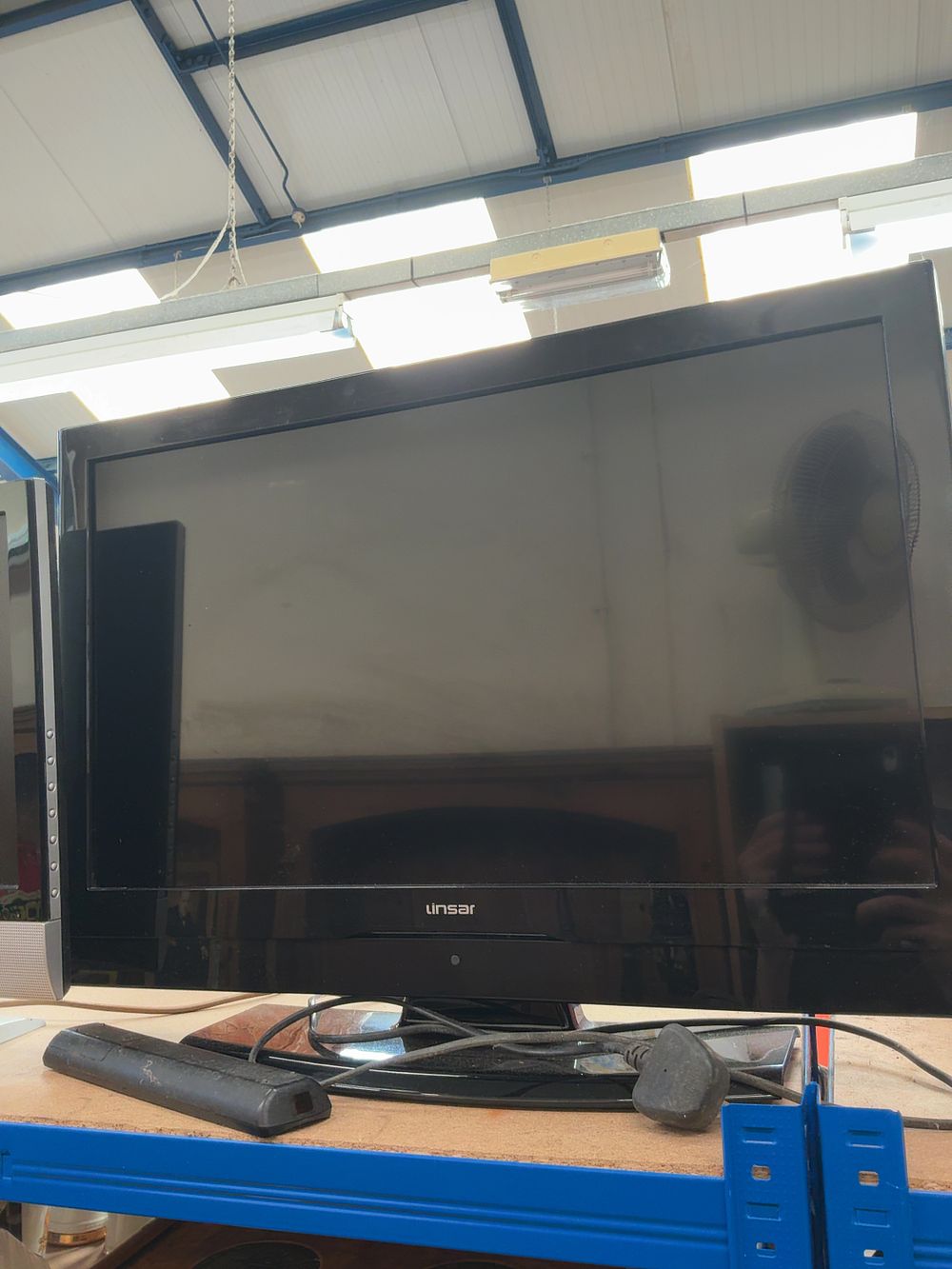 Lot 189: Two Flat-Screen LCD Televisions by Linsar and Polaroid