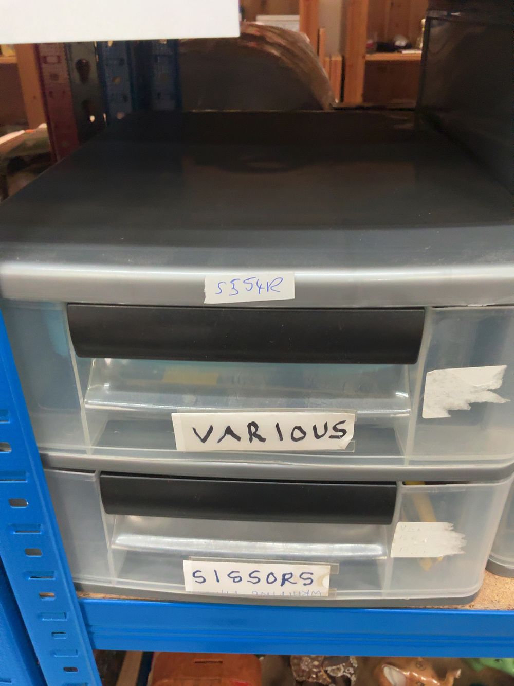 Lot 236: An Assortment of Plastic Storage Drawers and a Commemorative Book.