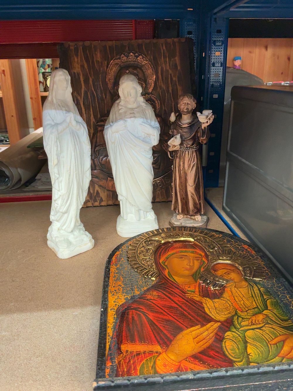 Lot 242: A Collection of Religious Devotional Items Including Statuettes, a Relief Plaque, and a Panel Icon