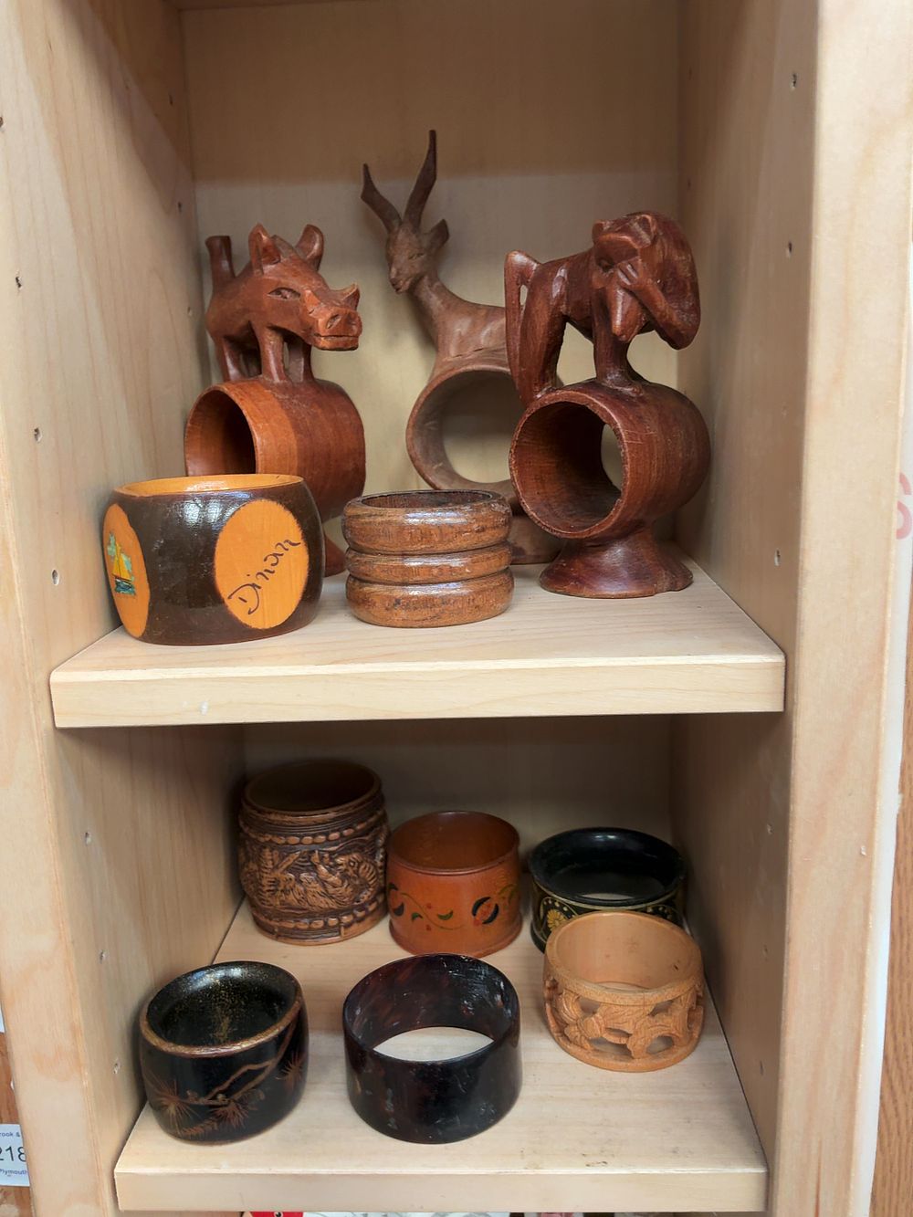 Lot 249: A Collection of Assorted Wooden, Ceramic, and Stone Napkin Rings