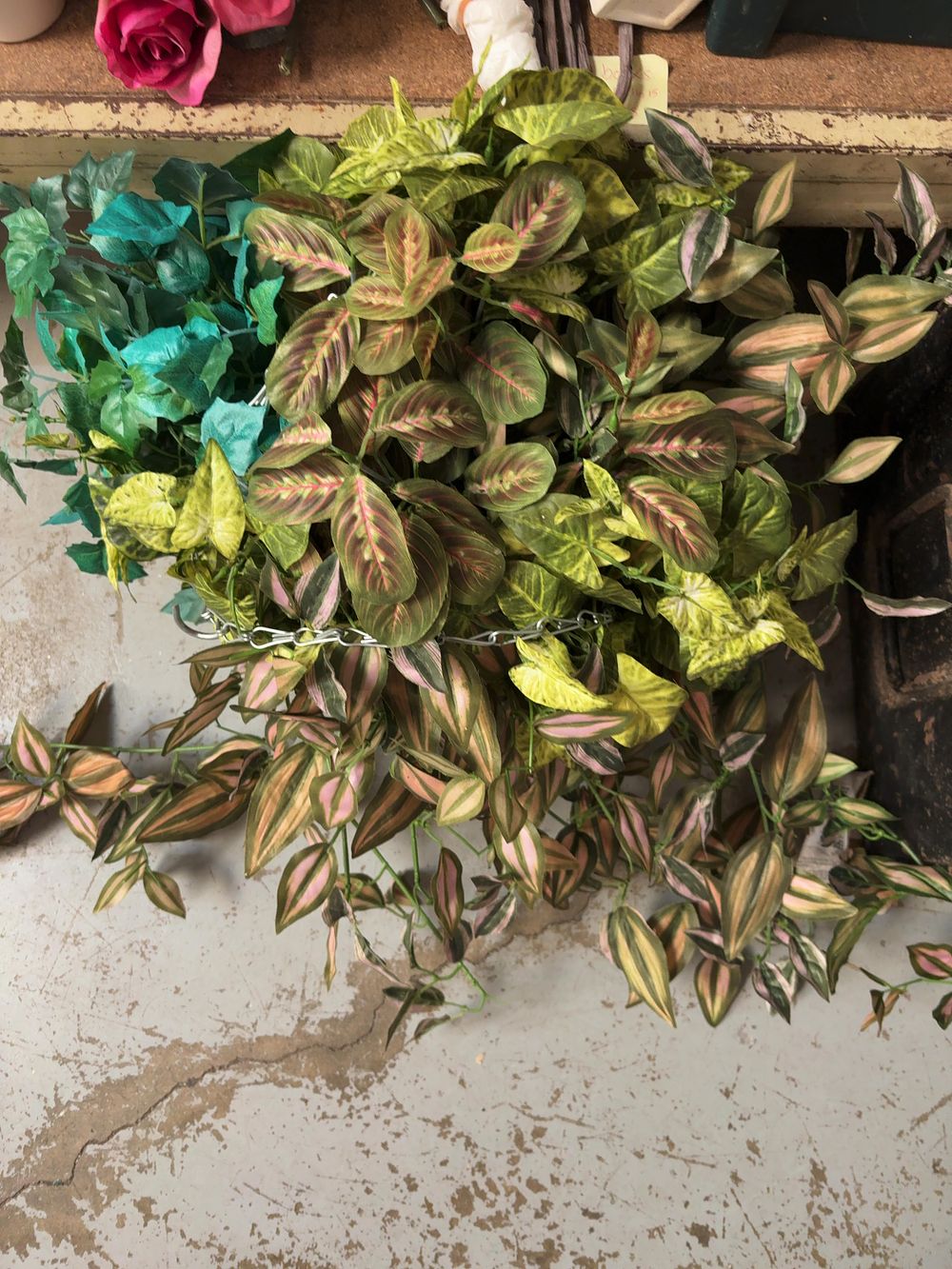 Lot 257: An Assortment of Artificial Foliage and Floral Arrangements and a Decorative vase.