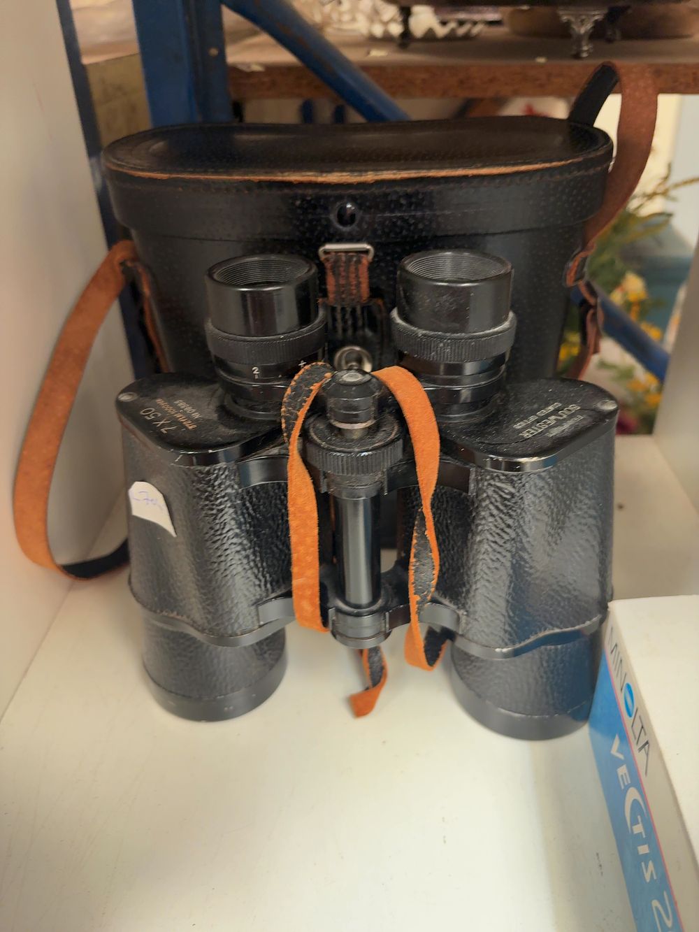 Lot 269: An Assortment of Vintage Optical and Photographic Equipment including Frampton's Binoculars, a Sigma Lens, and a Minolta Camera