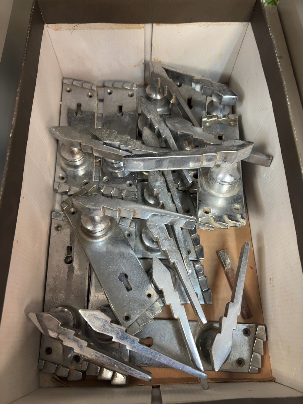 Lot 270: A Collection of Art Deco Chrome-Plated Lightning Bolt Lever Door Handles and Backplates
