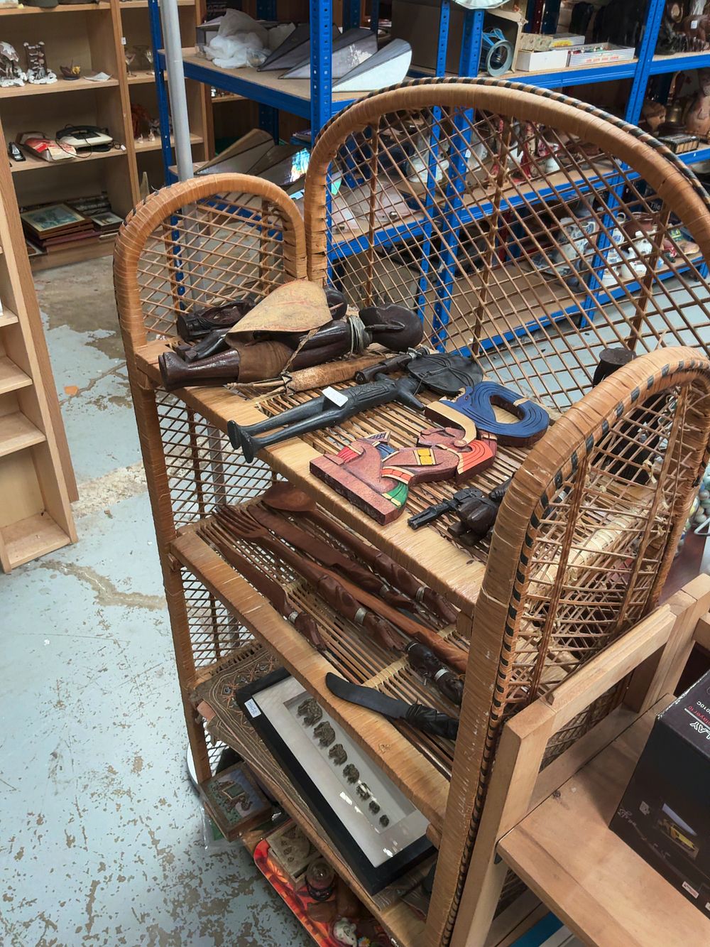 Lot 285: A Vintage Arched Rattan Three-Tier Shelving Unit