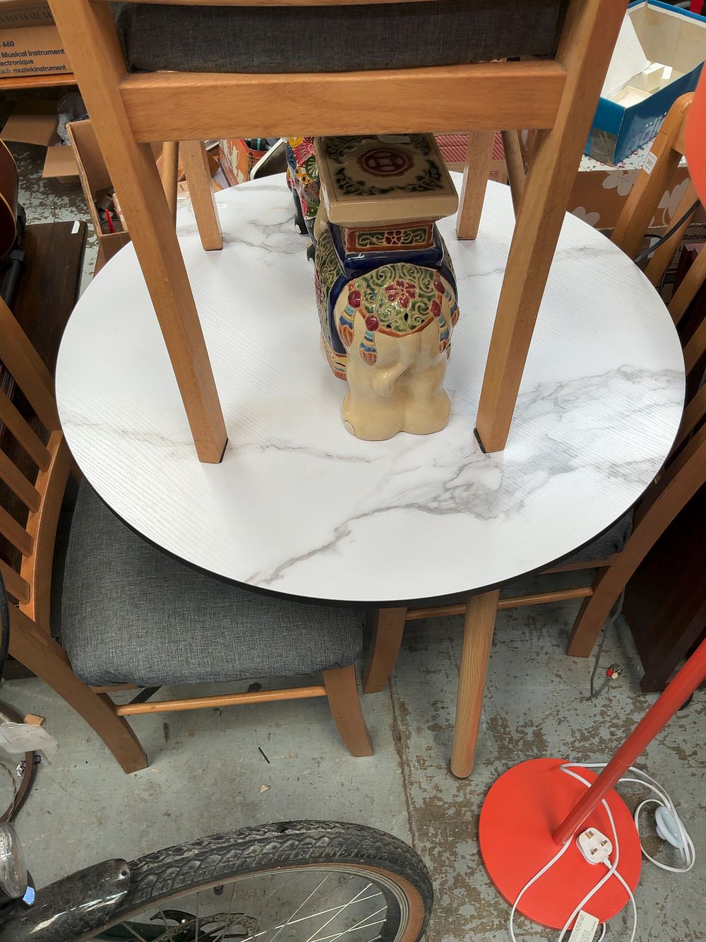 Lot 294: A Contemporary Round Marble Effect Dining Table with 3 Matching Chairs.