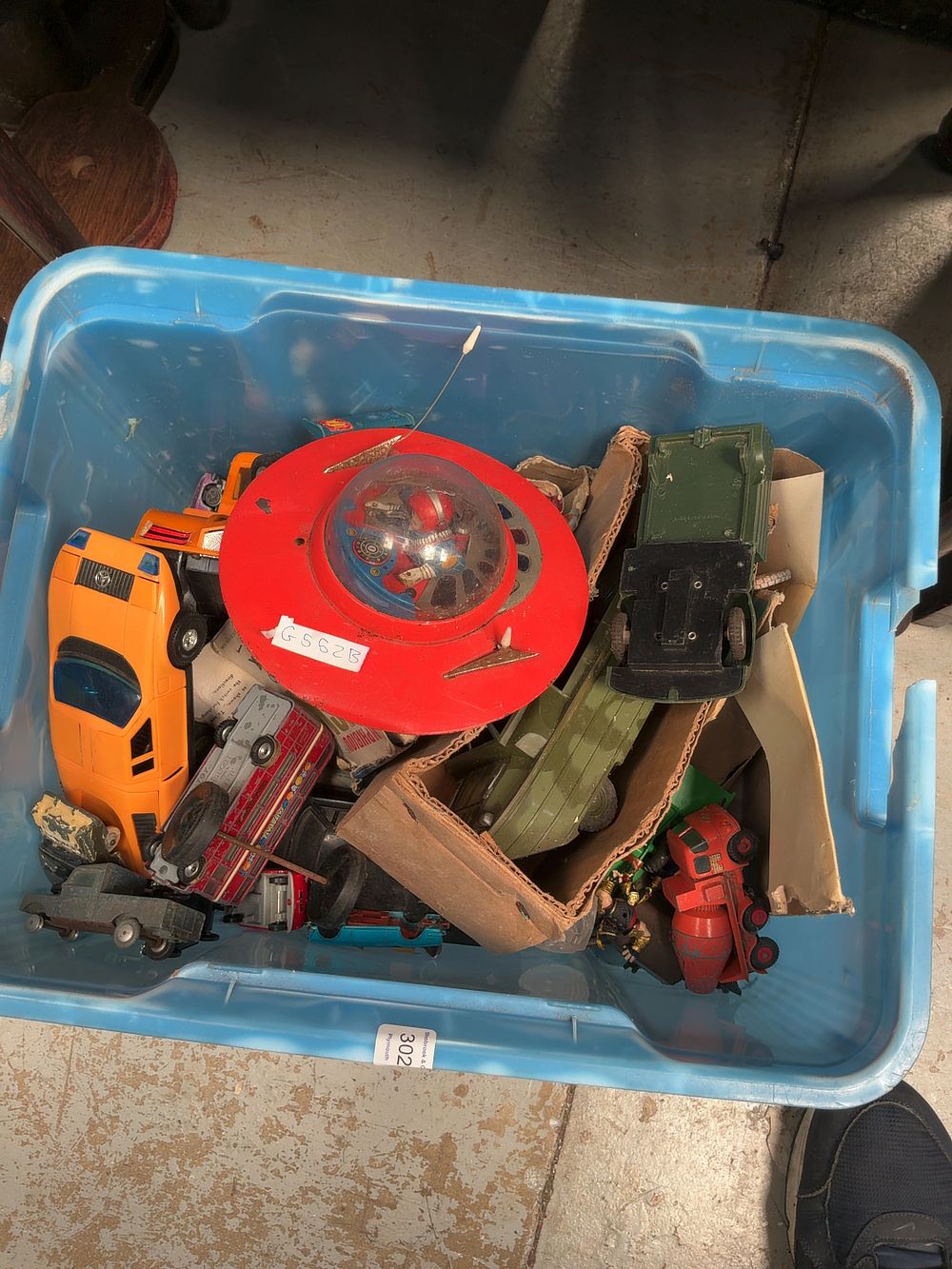 Lot 302: An Assortment of Vintage Tin-Plate and Plastic Toys including a Japanese Flying Saucer and a Marx Amphibious Vehicle