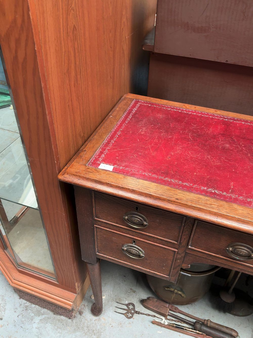 Lot 304: An English Georgian Revival Oak Kneehole Writing Desk with Leather Inset Top
