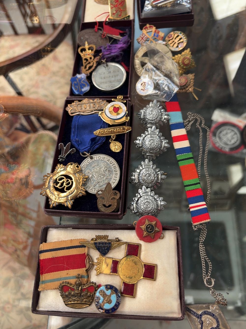 Lot 326: A Collection of British Medals, Enamel Badges, and Militaria Insignia