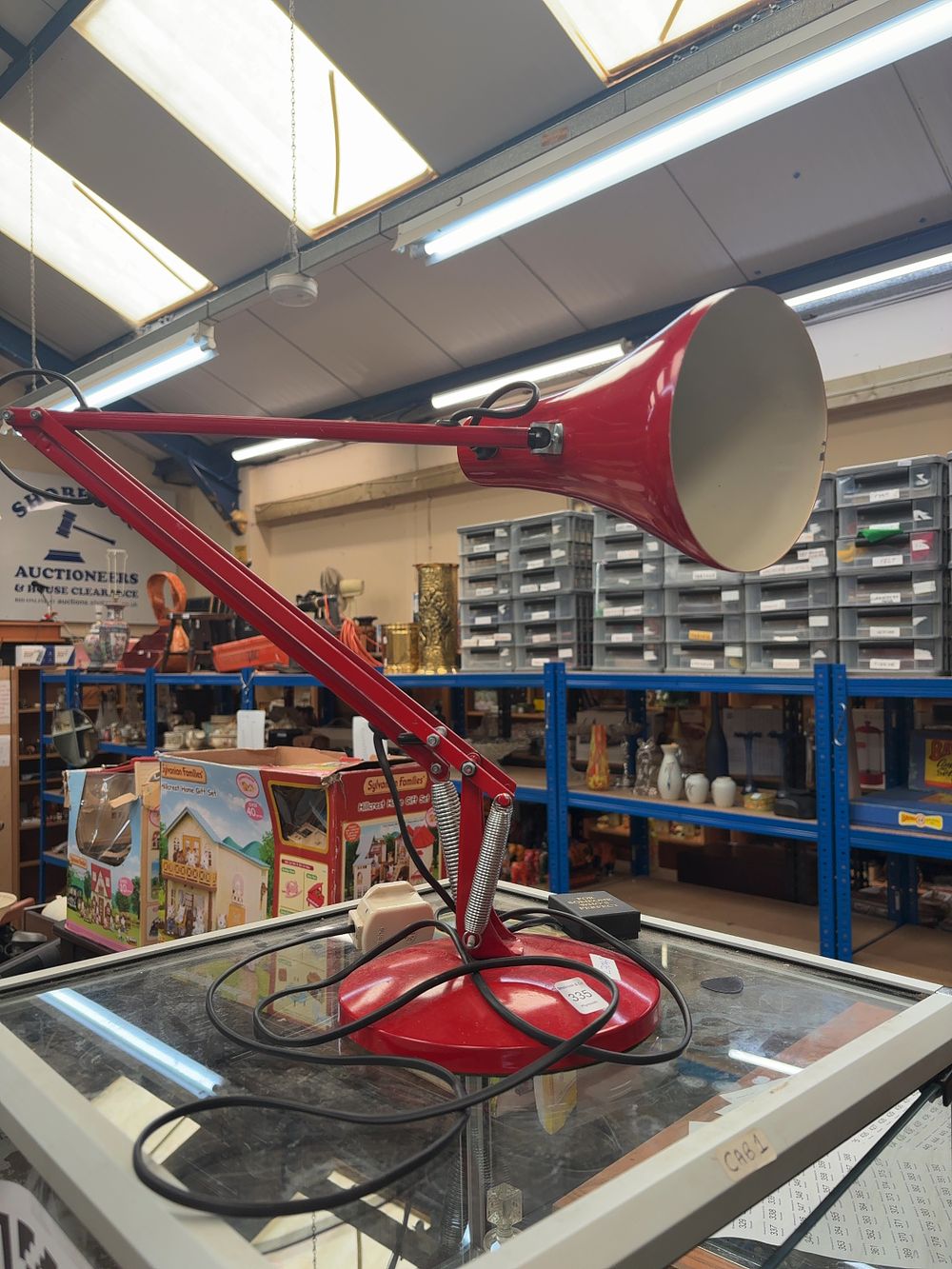 Lot 335: A vintage red adjustable desk lamp in the style of Anglepoise