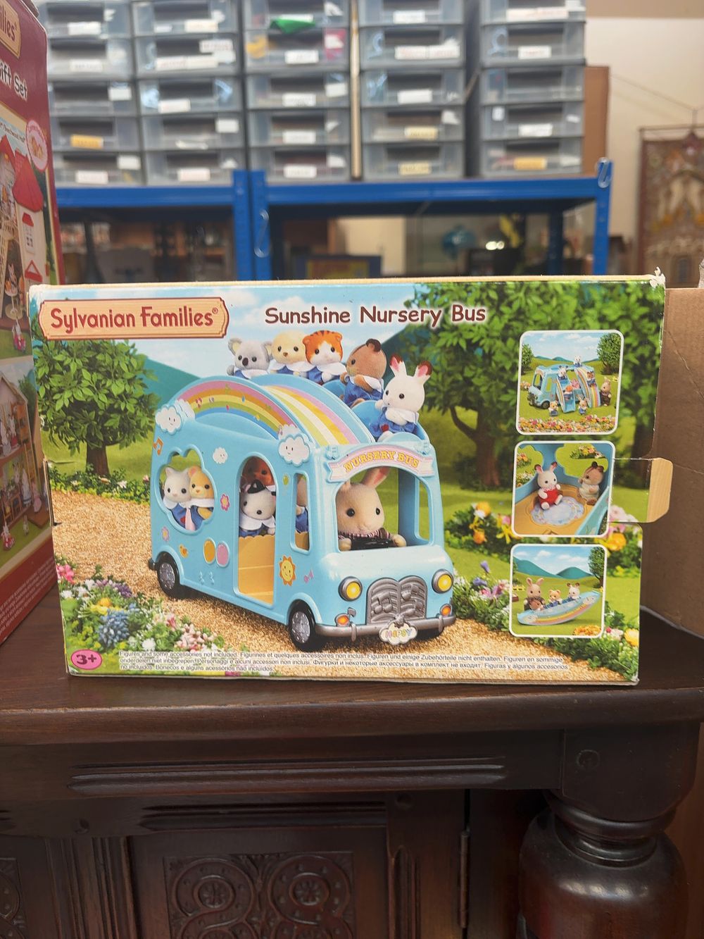 Lot 336: A Trio of Boxed Sylvanian Families Play Sets by Epoch comprising Sunshine Nursery Bus Hillcrest Home and Red Roof Cosy Cottage