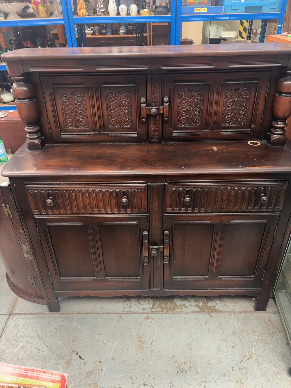 Lot 337: A Mid-20th Century Jacobean Revival Carved Oak Court Cupboard.