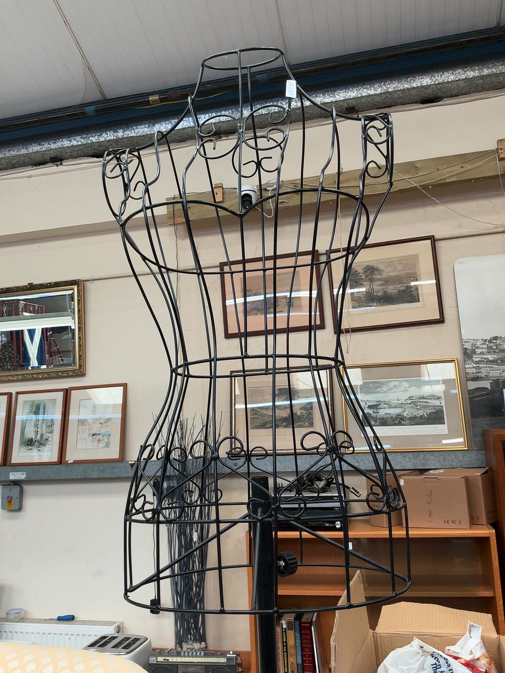 Lot 391: A Decorative Black Metal Wirework Female Dress Form on Height-adjustable Stand
