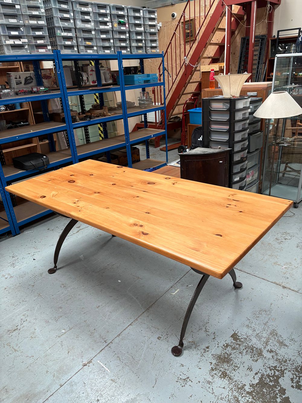 Lot 395: A Spanish Revival Style Pine and Wrought Iron Dining Table and 6 wicker chairs.