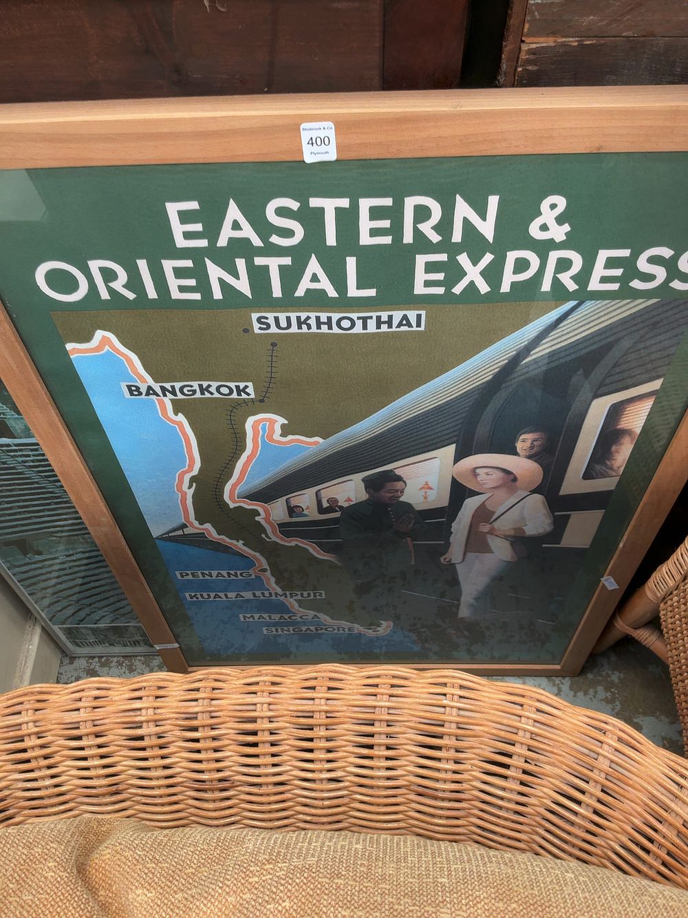Lot 400: Two Framed Travel Posters including Eastern and Oriental Express and Bosra Theatre Syria