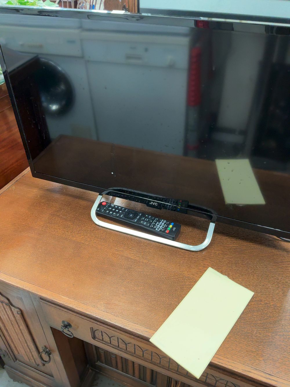 Lot 409: JVC Smart LED Television with Stand and Remote
