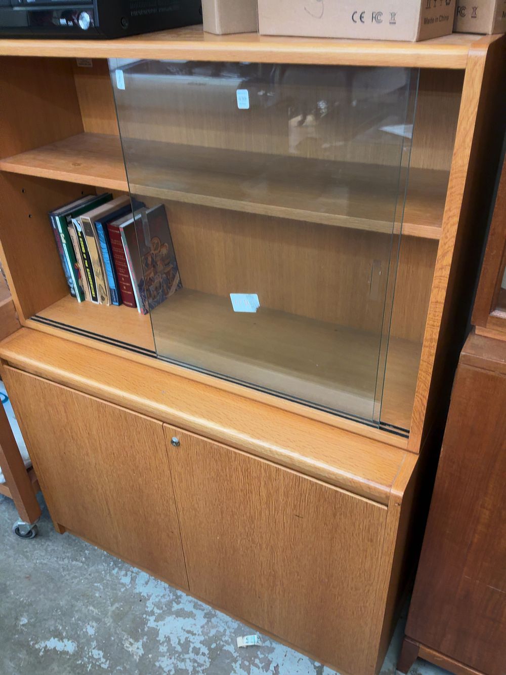 Lot 439: Mid-Century Modern Two-Piece Display Cabinet with Sliding Glass Doors