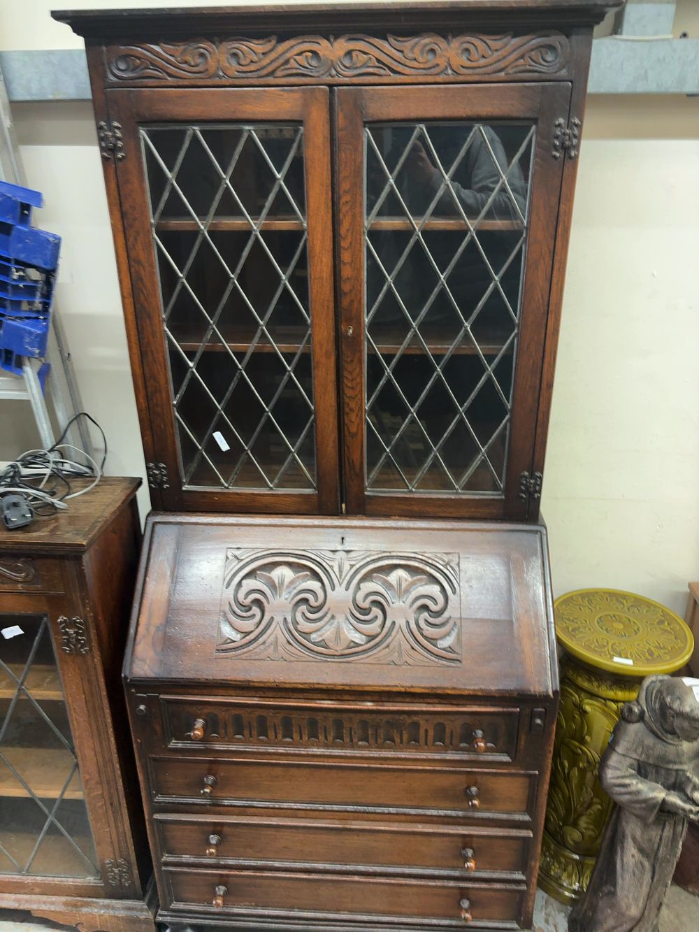Lot 480: A mid-20th-century Jacobean Revival style dark oak bureau bookcase