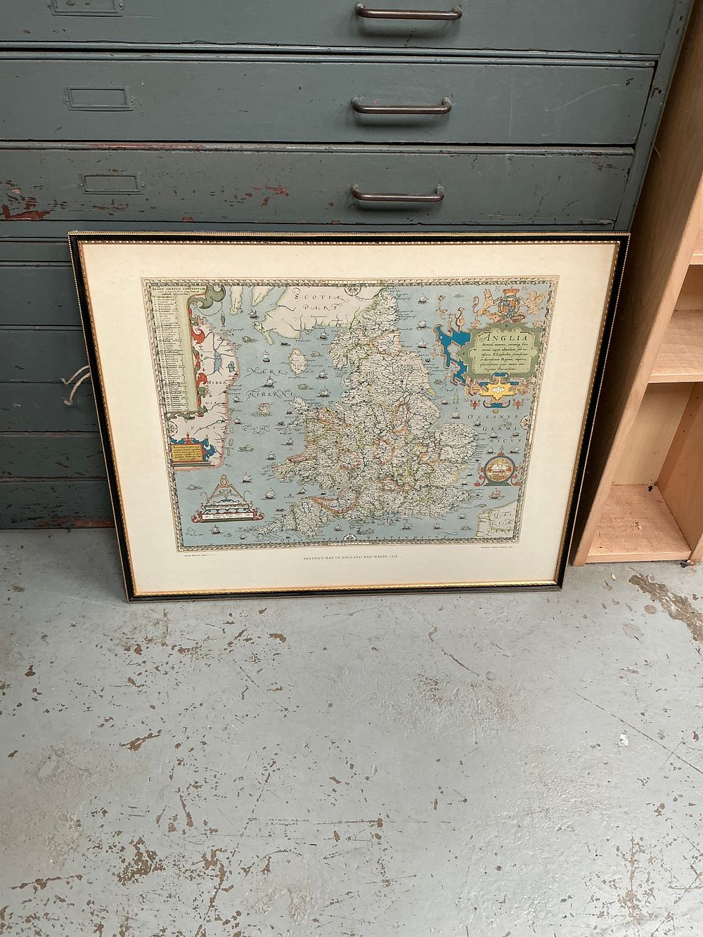 Lot 353: A Framed Colour Reproduction Map of England and Wales after Christopher Saxton 1579