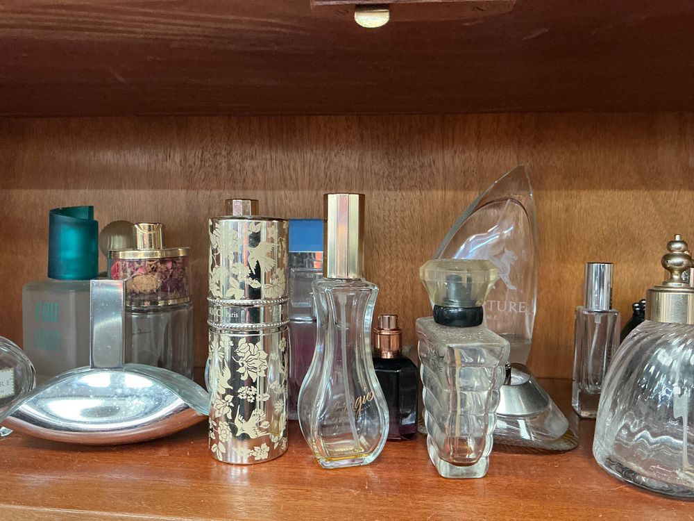 Lot 452: A Group of Assorted Glass Perfume and Fragrance Bottles, Including Chanel, Givenchy, and Nina Ricci