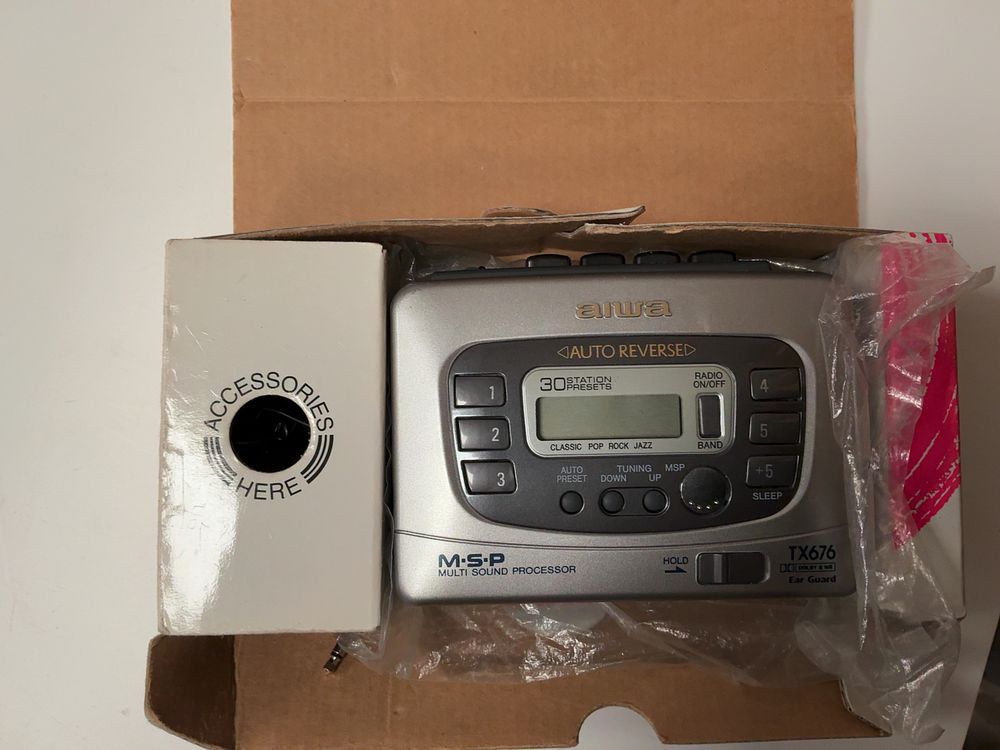 Lot 182: An Assortment of Vintage and Modern Personal Electronics including Sony, Aiwa, and Roberts