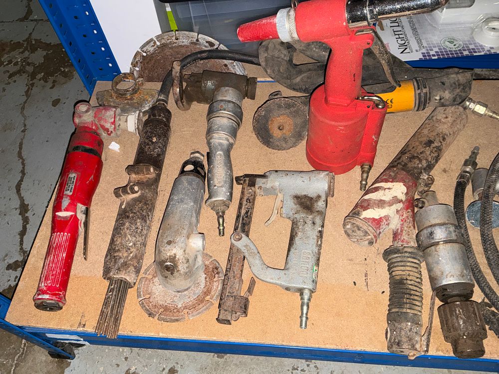 Lot 185: A Group of Industrial Pneumatic Tools including Senco, Desoutter, and Atlas Copco