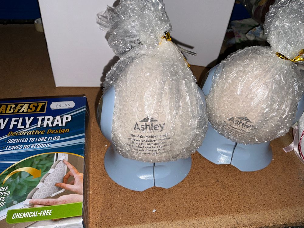 Lot 201: An Assortment of Household, Craft, and Fitness Items Including Dehumidifiers, Fly Traps, and Dumbbells