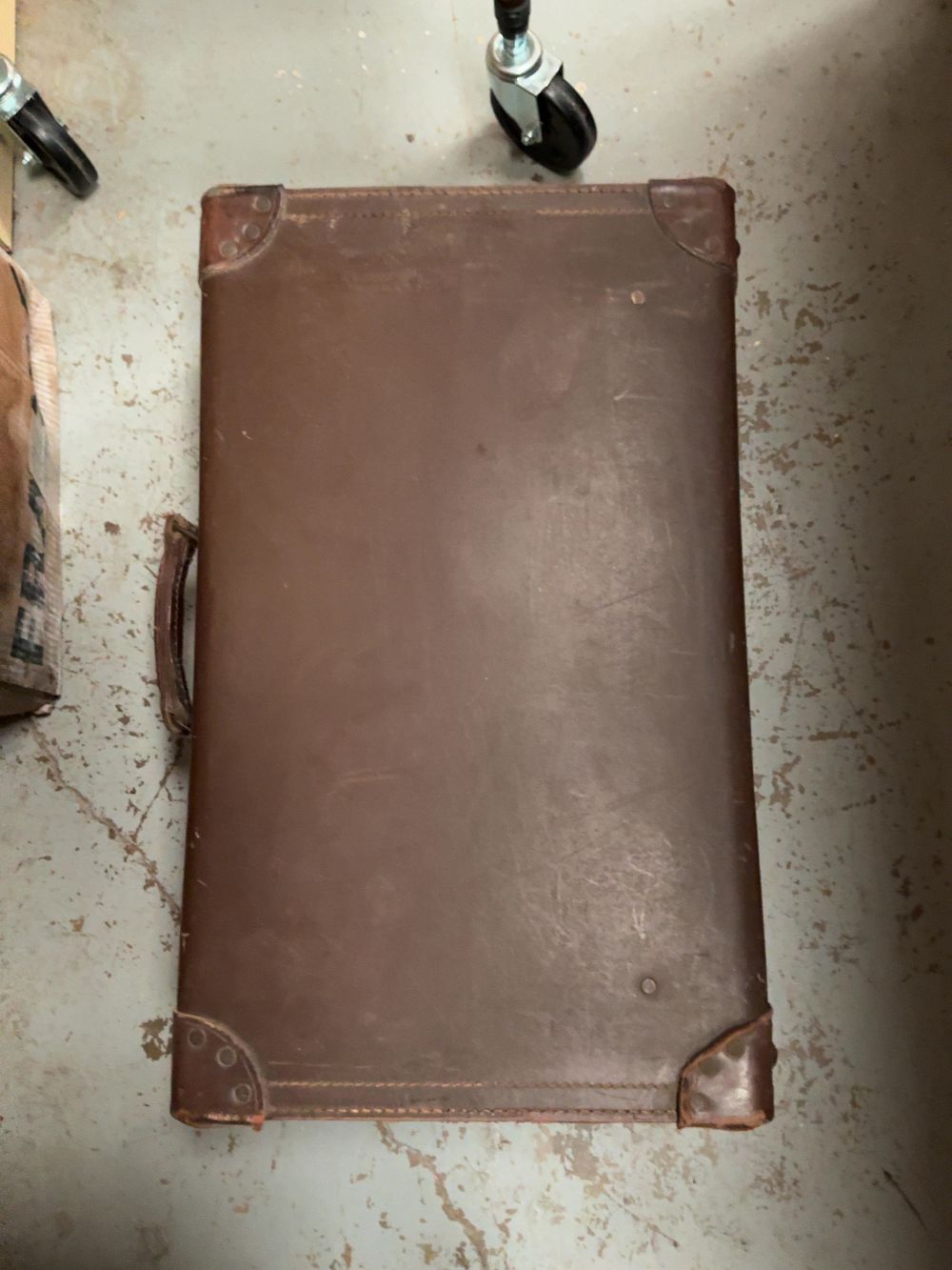 Lot 206: A vintage brown leather travel suitcase