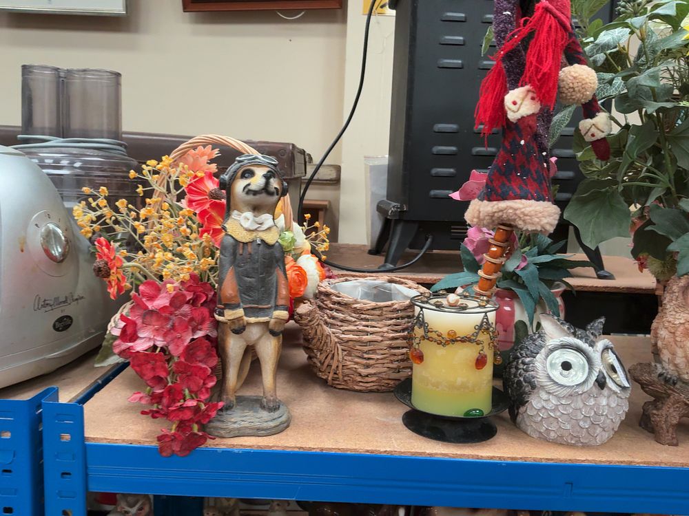 Lot 212: An Assortment of Decorative Figurines, Artificial Floral Arrangements.