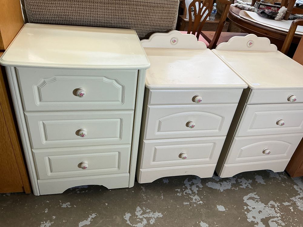 Lot 387: A Trio of French Provincial Style Cream Painted Bedside Chests