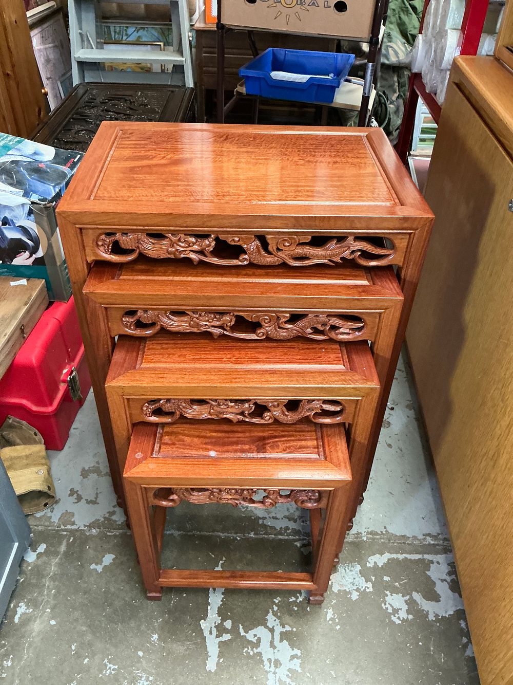 Lot 388: A Set of Four Chinese Carved Hardwood Nesting Tables