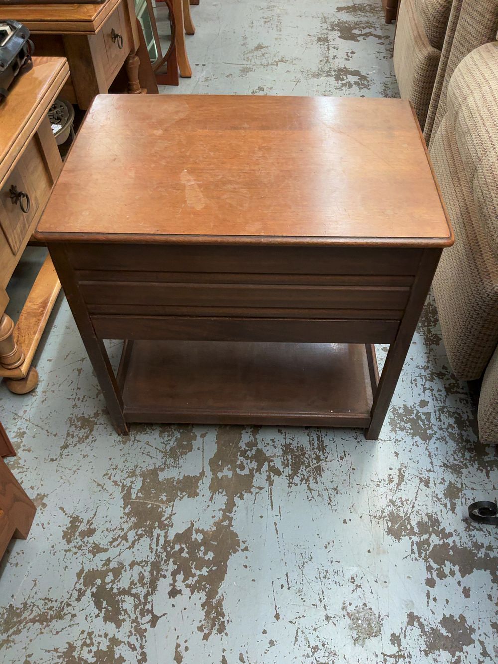 Lot 399: A mid-20th-century stained wood lift-top storage work table