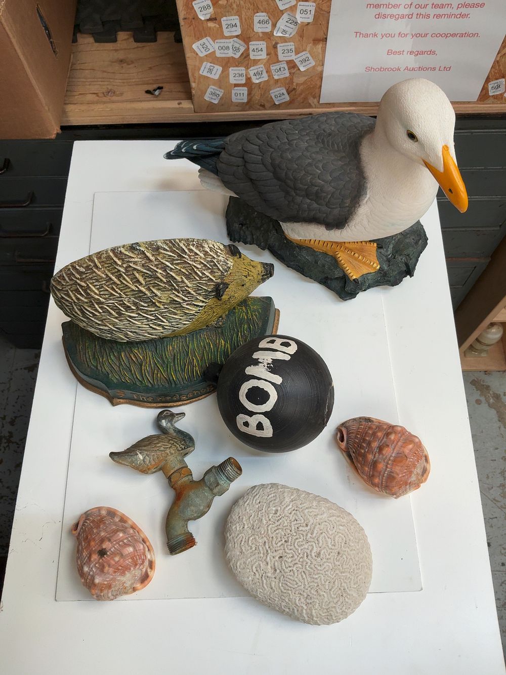 Lot 268: A Group of Decorative and Natural History Items including a Seagull Statue and a Cast Iron Doorstop