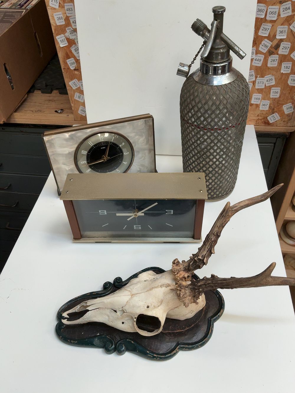 Lot 273: An Assortment of Vintage Items Including Metamec Mantel Clocks, a Soda Syphon, and a Mounted Roebuck Deer Skull